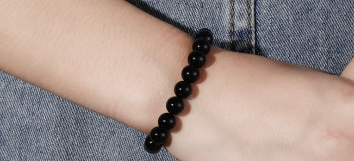 Black Onyx Bracelet - Balochistan LLC  Product information: Type: Bracelet Style: Women Modeling: geometric Health care function; resist fatigue Product name: black agate bracelet Product composition: black agate, imported elastic cord Bead size: 8MM Packing list: Bracelet*1