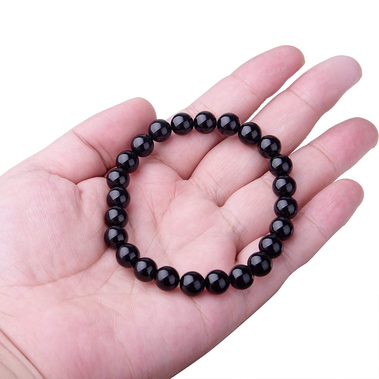 Black Onyx Bracelet - Balochistan LLC  Product information: Type: Bracelet Style: Women Modeling: geometric Health care function; resist fatigue Product name: black agate bracelet Product composition: black agate, imported elastic cord Bead size: 8MM Packing list: Bracelet*1