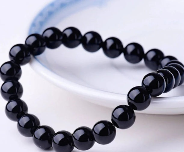 Black Onyx Bracelet - Balochistan LLC  Product information: Type: Bracelet Style: Women Modeling: geometric Health care function; resist fatigue Product name: black agate bracelet Product composition: black agate, imported elastic cord Bead size: 8MM Packing list: Bracelet*1