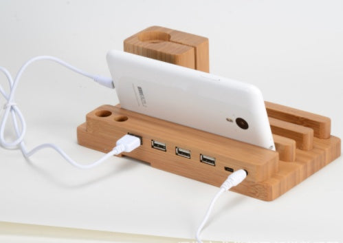 Compatible with Apple , Bamboo, wood andMobile applewatch bracket charging wooden bracket multi-function flat cell phone base - Balochistan LLC  Note： Non-Apple branded products,Compatible with iPhone models 1. Material: Wood Bamboo 2. Type: Universal Wood Bamboo Mobile Phone Tablet Holder Stand 3. Numbers of Port: 4 USB port 4. Size: approx 185x110x 80mm 5. Function: Mobile Phone Holder Stand For iPhone 5 5s se/6 6s 7/ 6 6s 7 Plus For Apple Watch charger stand For iPad mini 1/2/3/4 Tablets Desk Holder