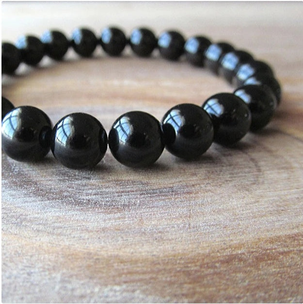 Black Onyx Bracelet - Balochistan LLC  Product information: Type: Bracelet Style: Women Modeling: geometric Health care function; resist fatigue Product name: black agate bracelet Product composition: black agate, imported elastic cord Bead size: 8MM Packing list: Bracelet*1